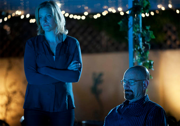 image of Skylar and Walt sitting by their pool at night, bathed in blue light